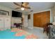 Cozy bedroom with large closet and flat screen TV at 1611 San Charles Dr, Dunedin, FL 34698