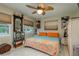 Spacious bedroom with ceiling fan and large bed at 1611 San Charles Dr, Dunedin, FL 34698