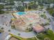 Aerial view of building with pool, parking, and landscaping at 2258 World Parkway W Blvd # 8, Clearwater, FL 33763