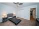 Bright bedroom features a ceiling fan, carpet floors, and a bed frame ready for mattress at 2258 World Parkway W Blvd # 8, Clearwater, FL 33763