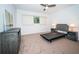 Bedroom with carpet, a window, ceiling fan and furnishings at 2258 World Parkway W Blvd # 8, Clearwater, FL 33763