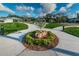 Beautifully landscaped common area featuring a sidewalk and globe sculpture made of plants and stone at 2258 World Parkway W Blvd # 8, Clearwater, FL 33763