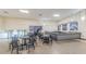 Community dining area features tables, chairs and a small bar/snack area at 2258 World Parkway W Blvd # 8, Clearwater, FL 33763