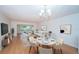 Bright living room with hardwood floors, modern furnishings, and a view of the neighborhood at 2258 World Parkway W Blvd # 8, Clearwater, FL 33763