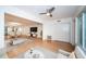 Open concept living area with hardwood floors, ceiling fan, and bright lighting perfect for entertaining at 2258 World Parkway W Blvd # 8, Clearwater, FL 33763