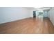Spacious living room features hardwood floors, bright natural light, and an open floor plan at 2258 World Parkway W Blvd # 8, Clearwater, FL 33763