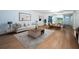 Open living room with stylish furniture, hardwood floors, and an open floor plan at 2258 World Parkway W Blvd # 8, Clearwater, FL 33763