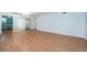 Open living room boasts hardwood floors, plenty of natural light, and a view to the kitchen at 2258 World Parkway W Blvd # 8, Clearwater, FL 33763