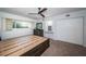 Bright main bedroom features a ceiling fan, and a large bed frame with drawer storage at 2258 World Parkway W Blvd # 8, Clearwater, FL 33763