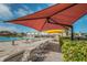 The pool and deck include lounge chairs and umbrellas at 2258 World Parkway W Blvd # 8, Clearwater, FL 33763