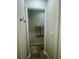 Clean bathroom with tile floors and a linen closet at 3053 Overlook Pl, Clearwater, FL 33760