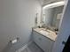 Updated bathroom with granite vanity and tile floor at 3053 Overlook Pl, Clearwater, FL 33760