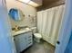 Clean bathroom with white vanity and a shower/tub combo at 3053 Overlook Pl, Clearwater, FL 33760