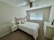 Bright bedroom with a ceiling fan and ample closet space at 3053 Overlook Pl, Clearwater, FL 33760