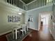 Bright dining room features a lofted ceiling and hardwood floors at 3053 Overlook Pl, Clearwater, FL 33760