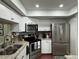 Modern kitchen with stainless steel appliances and granite countertops at 3053 Overlook Pl, Clearwater, FL 33760