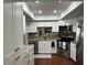 Modern kitchen with stainless steel appliances and granite countertops at 3053 Overlook Pl, Clearwater, FL 33760