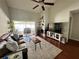 Living room with hardwood floors, fireplace and patio access at 3053 Overlook Pl, Clearwater, FL 33760
