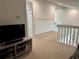 Loft area with a TV and additional storage at 3053 Overlook Pl, Clearwater, FL 33760