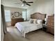 Main bedroom with carpeted floors and en-suite bathroom at 3053 Overlook Pl, Clearwater, FL 33760