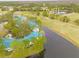 Condo complex near water and golf course, aerial view at 3609 Indigo Pond Dr, Palm Harbor, FL 34685