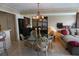 Bright dining area with a glass-top table and chandelier at 3753 46Th S Ave # 7, St Petersburg, FL 33711