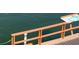 Wooden dock with railing, offering water access at 3753 46Th S Ave # 7, St Petersburg, FL 33711