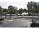 View of a street with palm trees and canal at 3753 46Th S Ave # 7, St Petersburg, FL 33711