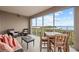 Serene screened balcony with water views and seating at 380 Aruba Cir # 203, Bradenton, FL 34209