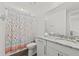 Clean bathroom with granite countertop, white cabinets, and shower at 380 Aruba Cir # 203, Bradenton, FL 34209