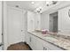Double vanity bathroom with granite countertop at 380 Aruba Cir # 203, Bradenton, FL 34209