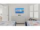 Bedroom with two twin beds and large dresser at 380 Aruba Cir # 203, Bradenton, FL 34209