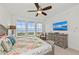 Spacious bedroom with water views and a king-size bed at 380 Aruba Cir # 203, Bradenton, FL 34209