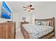 Spacious main bedroom with king-size bed and large TV at 380 Aruba Cir # 203, Bradenton, FL 34209