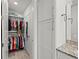 Spacious closet with built-in shelving and hanging rods at 380 Aruba Cir # 203, Bradenton, FL 34209