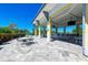 Outdoor community patio with seating, bar, and water views at 380 Aruba Cir # 203, Bradenton, FL 34209