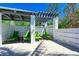 Covered lounge area with green cushioned chairs at 380 Aruba Cir # 203, Bradenton, FL 34209