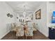 Coastal-themed dining room with a glass table and six chairs at 380 Aruba Cir # 203, Bradenton, FL 34209