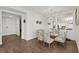 Bright dining area with glass table and patterned chairs at 380 Aruba Cir # 203, Bradenton, FL 34209