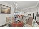 Open dining area with kitchen view and stylish light fixture at 380 Aruba Cir # 203, Bradenton, FL 34209