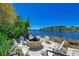 Community fire pit with seating and water views at 380 Aruba Cir # 203, Bradenton, FL 34209