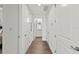 Clean and bright hallway with access to bedrooms and bathrooms at 380 Aruba Cir # 203, Bradenton, FL 34209