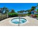 Community hot tub with waterfront view and seating area at 380 Aruba Cir # 203, Bradenton, FL 34209