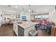 Modern kitchen with island, stainless steel appliances, and water view at 380 Aruba Cir # 203, Bradenton, FL 34209