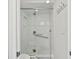 Walk-in shower with glass enclosure and marble tile at 380 Aruba Cir # 203, Bradenton, FL 34209