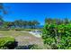 Scenic waterfront view with lush landscaping at 380 Aruba Cir # 203, Bradenton, FL 34209
