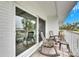 Balcony with rocking chairs and sliding glass door at 4250 37Th S St # 5, St Petersburg, FL 33711