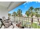 Relaxing balcony with rocking chairs and view of palm trees at 4250 37Th S St # 5, St Petersburg, FL 33711
