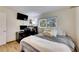 Spacious bedroom with wood-look floors and large window at 4250 37Th S St # 5, St Petersburg, FL 33711