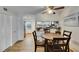 Bright dining area with kitchen views and wood-toned table at 4250 37Th S St # 5, St Petersburg, FL 33711